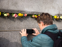 Flowers at Berlin Wall Memorial after the commemoration ceremony marking the 35th anniversary of the fall of the Berlin Wall. Berlin, German...