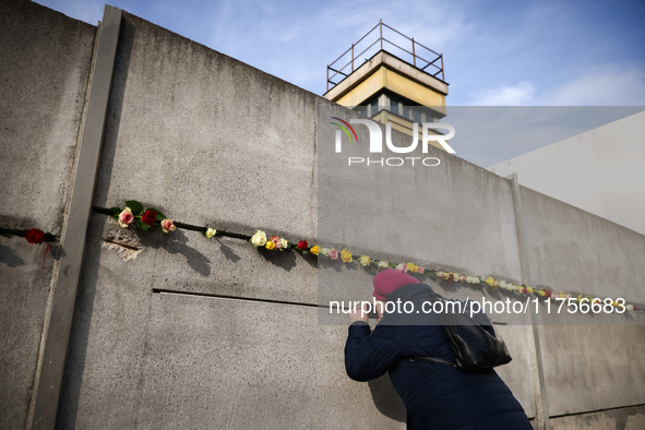 Flowers at Berlin Wall Memorial after the commemoration ceremony marking the 35th anniversary of the fall of the Berlin Wall. Berlin, German...