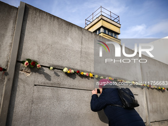 Flowers at Berlin Wall Memorial after the commemoration ceremony marking the 35th anniversary of the fall of the Berlin Wall. Berlin, German...