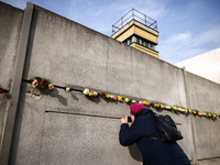 Flowers at Berlin Wall Memorial after the commemoration ceremony marking the 35th anniversary of the fall of the Berlin Wall. Berlin, German...