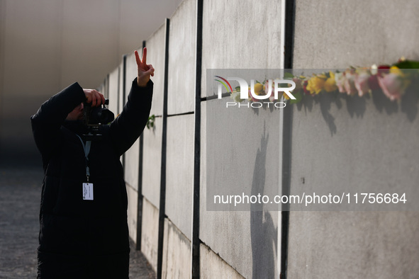 Flowers at Berlin Wall Memorial after the commemoration ceremony marking the 35th anniversary of the fall of the Berlin Wall. Berlin, German...