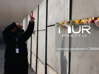 Flowers at Berlin Wall Memorial after the commemoration ceremony marking the 35th anniversary of the fall of the Berlin Wall. Berlin, German...