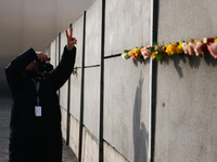 Flowers at Berlin Wall Memorial after the commemoration ceremony marking the 35th anniversary of the fall of the Berlin Wall. Berlin, German...