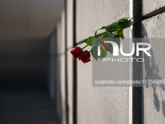 Flowers at Berlin Wall Memorial after the commemoration ceremony marking the 35th anniversary of the fall of the Berlin Wall. Berlin, German...