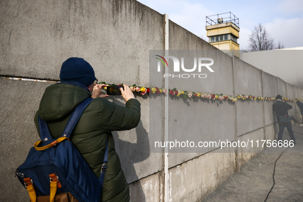 Flowers at Berlin Wall Memorial after the commemoration ceremony marking the 35th anniversary of the fall of the Berlin Wall. Berlin, German...