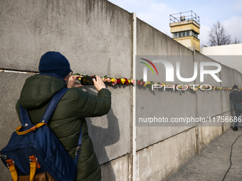 Flowers at Berlin Wall Memorial after the commemoration ceremony marking the 35th anniversary of the fall of the Berlin Wall. Berlin, German...