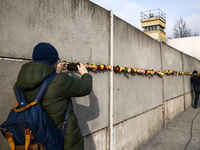 Flowers at Berlin Wall Memorial after the commemoration ceremony marking the 35th anniversary of the fall of the Berlin Wall. Berlin, German...