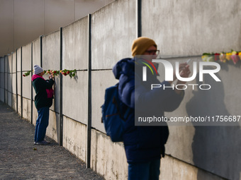 Flowers at Berlin Wall Memorial after the commemoration ceremony marking the 35th anniversary of the fall of the Berlin Wall. Berlin, German...