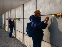 Flowers at Berlin Wall Memorial after the commemoration ceremony marking the 35th anniversary of the fall of the Berlin Wall. Berlin, German...