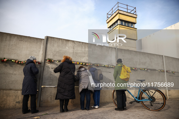 Flowers at Berlin Wall Memorial after the commemoration ceremony marking the 35th anniversary of the fall of the Berlin Wall. Berlin, German...