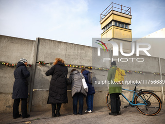 Flowers at Berlin Wall Memorial after the commemoration ceremony marking the 35th anniversary of the fall of the Berlin Wall. Berlin, German...