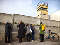 Flowers at Berlin Wall Memorial after the commemoration ceremony marking the 35th anniversary of the fall of the Berlin Wall. Berlin, German...