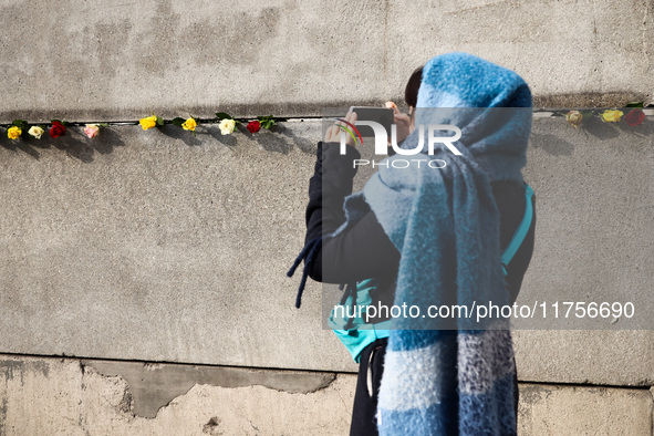 Flowers at Berlin Wall Memorial after the commemoration ceremony marking the 35th anniversary of the fall of the Berlin Wall. Berlin, German...