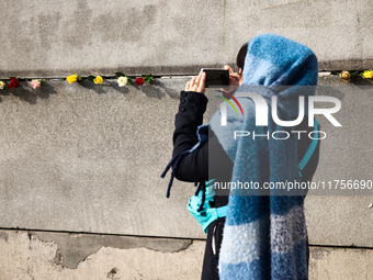 Flowers at Berlin Wall Memorial after the commemoration ceremony marking the 35th anniversary of the fall of the Berlin Wall. Berlin, German...