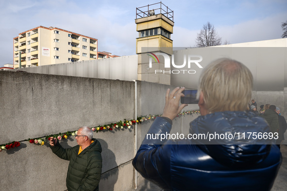 Flowers at Berlin Wall Memorial after the commemoration ceremony marking the 35th anniversary of the fall of the Berlin Wall. Berlin, German...