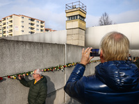 Flowers at Berlin Wall Memorial after the commemoration ceremony marking the 35th anniversary of the fall of the Berlin Wall. Berlin, German...