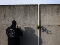 Flowers at Berlin Wall Memorial after the commemoration ceremony marking the 35th anniversary of the fall of the Berlin Wall. Berlin, German...