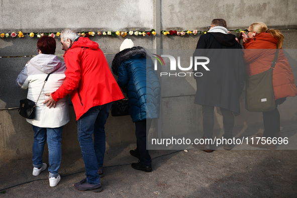 Flowers at Berlin Wall Memorial after the commemoration ceremony marking the 35th anniversary of the fall of the Berlin Wall. Berlin, German...