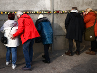 Flowers at Berlin Wall Memorial after the commemoration ceremony marking the 35th anniversary of the fall of the Berlin Wall. Berlin, German...