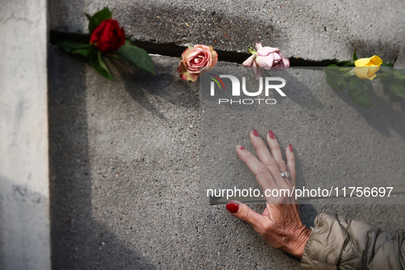 Flowers at Berlin Wall Memorial after the commemoration ceremony marking the 35th anniversary of the fall of the Berlin Wall. Berlin, German...