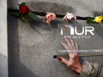 Flowers at Berlin Wall Memorial after the commemoration ceremony marking the 35th anniversary of the fall of the Berlin Wall. Berlin, German...