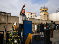 A man poses for a picture at Berlin Wall Memorial after the commemoration ceremony marking the 35th anniversary of the fall of the Berlin Wa...