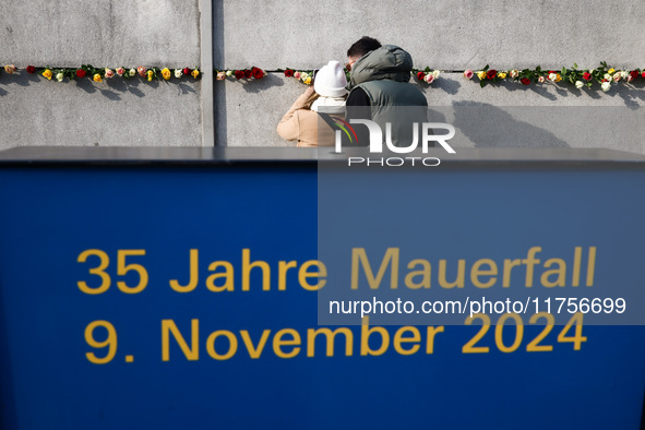 Flowers at Berlin Wall Memorial after the commemoration ceremony marking the 35th anniversary of the fall of the Berlin Wall. Berlin, German...