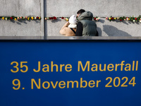 Flowers at Berlin Wall Memorial after the commemoration ceremony marking the 35th anniversary of the fall of the Berlin Wall. Berlin, German...