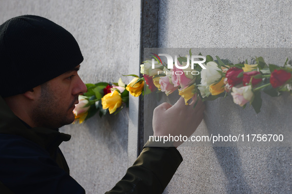 Flowers at Berlin Wall Memorial after the commemoration ceremony marking the 35th anniversary of the fall of the Berlin Wall. Berlin, German...