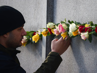 Flowers at Berlin Wall Memorial after the commemoration ceremony marking the 35th anniversary of the fall of the Berlin Wall. Berlin, German...