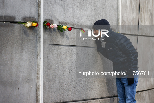 Flowers at Berlin Wall Memorial after the commemoration ceremony marking the 35th anniversary of the fall of the Berlin Wall. Berlin, German...