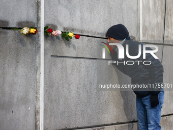 Flowers at Berlin Wall Memorial after the commemoration ceremony marking the 35th anniversary of the fall of the Berlin Wall. Berlin, German...