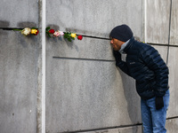 Flowers at Berlin Wall Memorial after the commemoration ceremony marking the 35th anniversary of the fall of the Berlin Wall. Berlin, German...