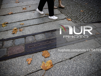 A plaque at Berlin Wall Memorial during the commemoration ceremony marking the 35th anniversary of the fall of the Berlin Wall. Berlin, Germ...