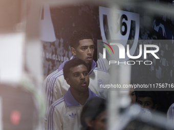 Jude Bellingham of Real Madrid and Rodrygo Goes of Real Madrid are in the locker room tunnel during the La Liga 2024/25 match between Real M...