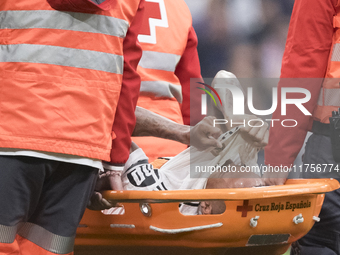 Eder Militao of Real Madrid is injured during the La Liga 2024/25 match between Real Madrid and Osasuna at Santiago Bernabeu Stadium in Madr...