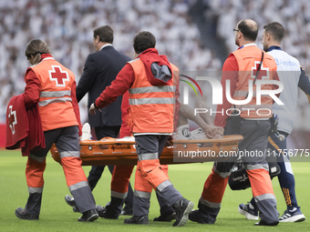 Eder Militao of Real Madrid is injured during the La Liga 2024/25 match between Real Madrid and Osasuna at Santiago Bernabeu Stadium in Madr...