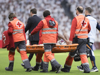 Eder Militao of Real Madrid is injured during the La Liga 2024/25 match between Real Madrid and Osasuna at Santiago Bernabeu Stadium in Madr...