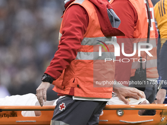 Eder Militao of Real Madrid is injured during the La Liga 2024/25 match between Real Madrid and Osasuna at Santiago Bernabeu Stadium in Madr...