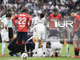 Eder Militao of Real Madrid is injured during the La Liga 2024/25 match between Real Madrid and Osasuna at Santiago Bernabeu Stadium in Madr...