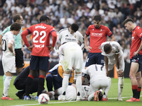 Eder Militao of Real Madrid is injured during the La Liga 2024/25 match between Real Madrid and Osasuna at Santiago Bernabeu Stadium in Madr...