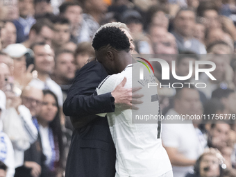 Vinicius Jr of Real Madrid celebrates a goal with Real Madrid coach Carlo Ancelotti during the La Liga 2024/25 match between Real Madrid and...