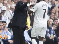 Vinicius Jr of Real Madrid celebrates a goal with Real Madrid coach Carlo Ancelotti during the La Liga 2024/25 match between Real Madrid and...