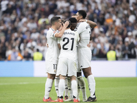 In Madrid, Spain, on November 9, several Real Madrid players celebrate a goal during the La Liga 2024/25 match between Real Madrid and Osasu...