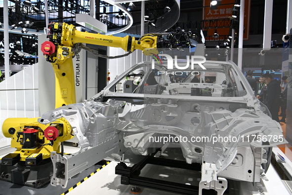 Hexagon's 3D composite inspection system performs a quality inspection demonstration on a vehicle in the Technical equipment exhibition area...