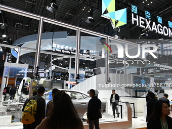 Visitors explore Hexagon's new technologies, achievements, and exhibits in the technical equipment exhibition area of the 7th China Internat...