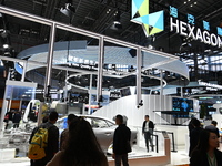 Visitors explore Hexagon's new technologies, achievements, and exhibits in the technical equipment exhibition area of the 7th China Internat...