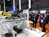 Hexagon's 3D composite inspection system performs a quality inspection demonstration on a vehicle in the Technical equipment exhibition area...