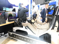 Visitors explore Hexagon's new technologies, achievements, and exhibits in the technical equipment exhibition area of the 7th China Internat...