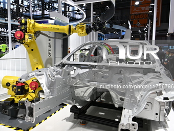 Hexagon's 3D composite inspection system performs a quality inspection demonstration on a vehicle in the Technical equipment exhibition area...